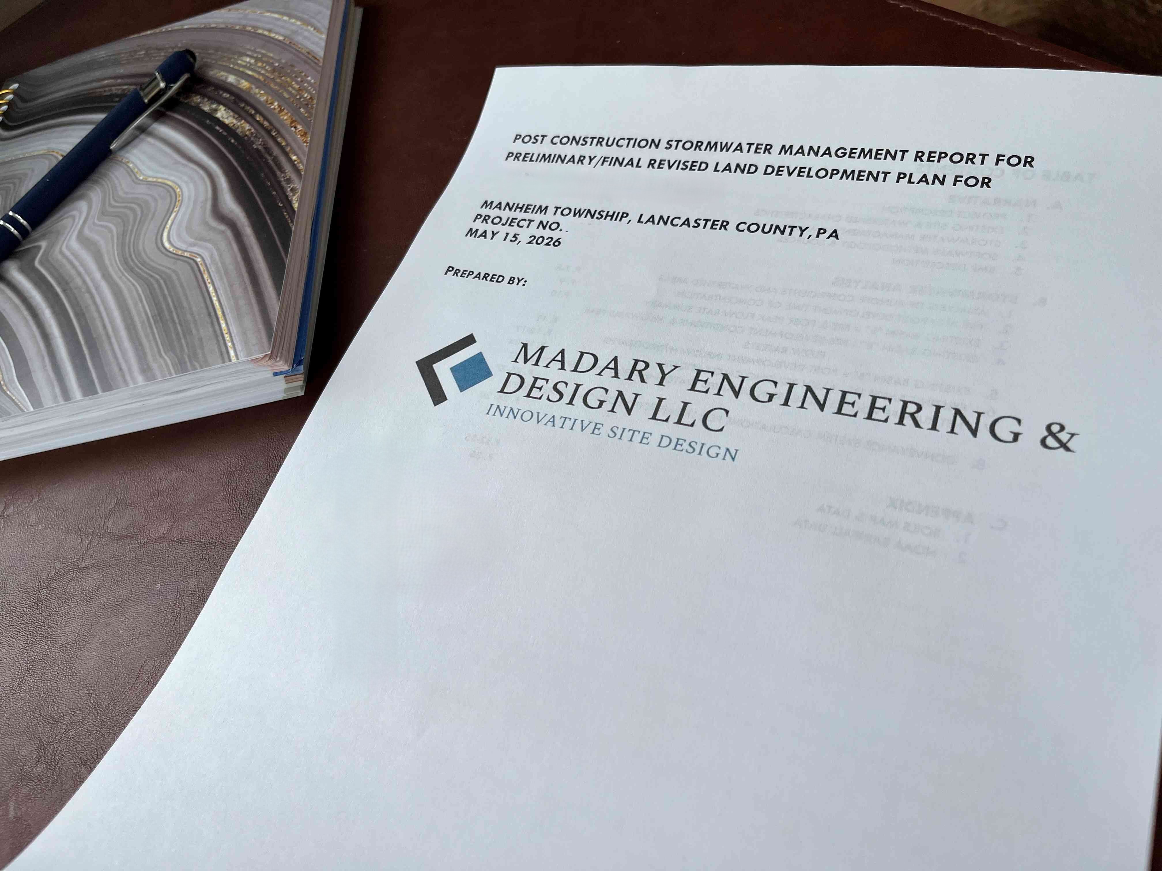 Cover page of a stormwater management report prepared by Madary Engineering & Design